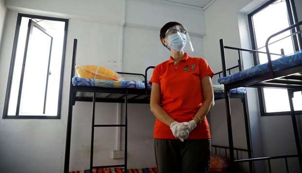 (file photo) Singapore's Minister of Manpower Josephine Teo tours a dormitory room for migrant workers who have recovered from the coronavirus disease (Covid-19), amid the outbreak in Singapore