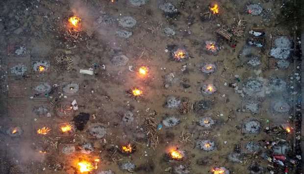 A mass cremation of victims who died due to the coronavirus disease (Covid-19), is seen at a crematorium ground in New Delhi