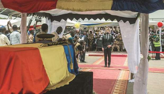 French President Emmanuel Macron pays his respects in front of the coffin of late Chadian president Idriss Deby during his state funeral in Nu2019Djamena, yesterday.