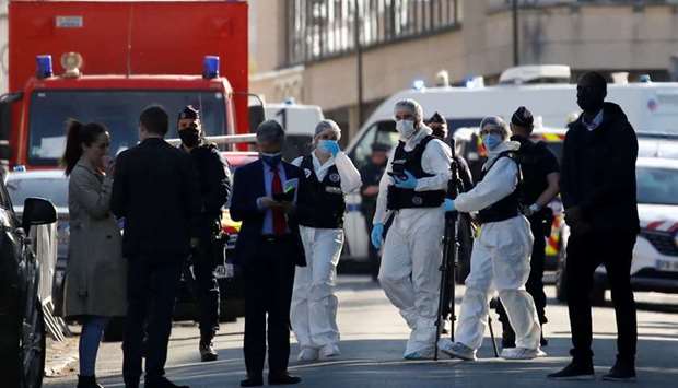 Police officers secure the area where an attacker stabbed a female police administrative worker, in Rambouillet, near Paris, France