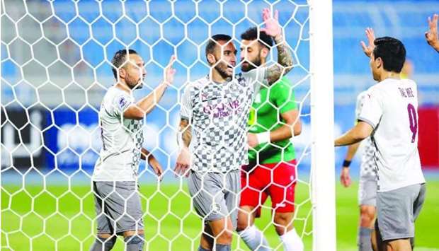 Al Sadd players celebrate a goal during the AFC Champions League match against Al Wehdat on Friday.