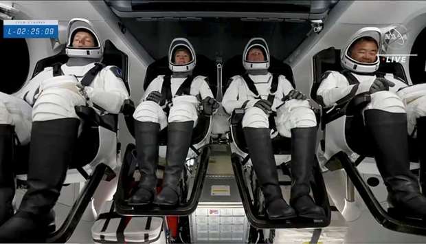 ESA astronaut Thomas Pesquet OF France, NASA astronauts Shane Kimbrough and Megan McArthur, and JAXA astronaut Akihiko Hoshide of Japan await the launch of their NASA commercial crew mission to the International Space Station, within the Crew Dragon capsule of the SpaceX Falcon 9 rocket at Kennedy Space Center in Cape Canaveral, Florida