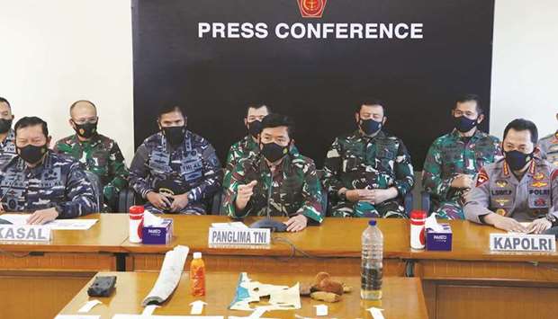 Indonesian military chief Hadi Tjahjanto delivers his speech as the debris believed to be from the missing Indonesian Navy KRI Nanggala-402 submarine is displayed during a media conference at Ngurah Rai Airport in Bali, yesterday.