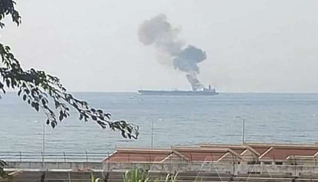 A handout picture released by the official Syrian Arab News Agency (SANA) yesterday, shows smoke billowing from a tanker off the coast of the western Syrian city of Baniyas.