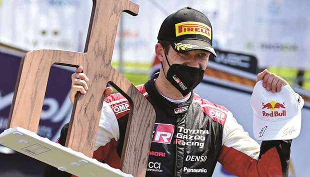 French Sebastien Ogier holds the trophy after winning the Croatia Rally, the third round of the FIA World Rally Championship in Kumrovec, north of Zagreb. (AFP)