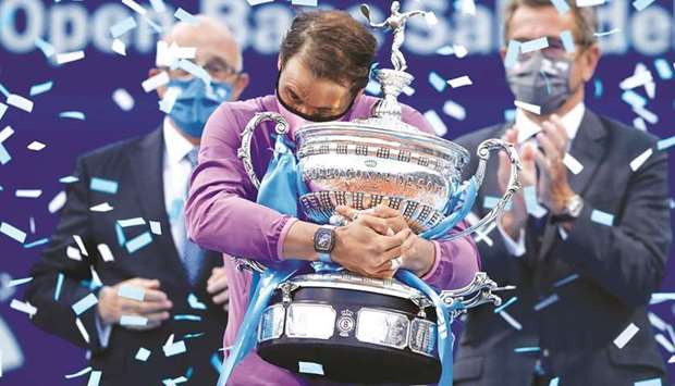 Spainu2019s Rafael Nadal (also above) celebrates with the winneru2019s trophy after beating Greeceu2019s Stefanos Tsitsipas (not pictured) in the Barcelona Open final yesterday. (Reuters)