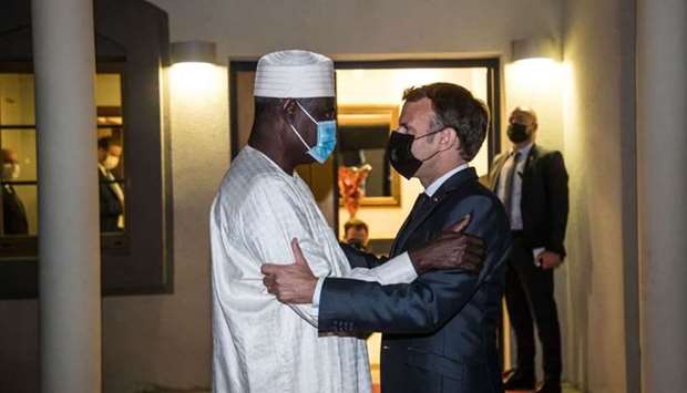 French President Emmanuel Macron greets Chairman of the African Union Commission Moussa Faki Mahamat after a meeting with African leaders of the Sahel countries as part of the funerals of Chad President Idriss Deby, in N'Djamena, Chad, April 22