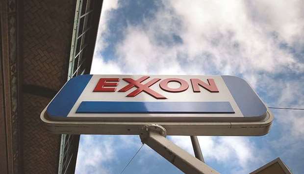 A sign for an Exxon gas station stands in New York City. Exxon Mobilu2019s effort to build an energy trading business to compete with those of European oil majors unravelled quickly last year as the firm slashed the unitu2019s funding amid broader spending cuts, people familiar with the matter told Reuters.