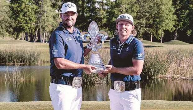 Cameron Smith and Marc Leishman hold up the trophy after winning the Zurich Classic tournament. (USA TODAY Sports)
