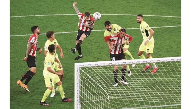 Athletic Bilbaou2019s Inigo Martinez (centre) scores against Atletico Madrid during the La Liga match on Sunday. (Reuters)