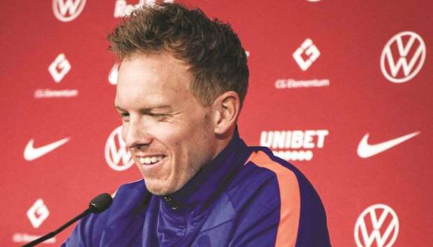RB Leipzigu2019s outgoing coach Julian Nagelsmann smiles during a press conference in Leipzig, Germany, yesterday. (AFP)