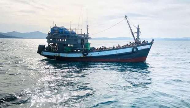 (File photo) A boat thought to be carrying Rohingya migrants is detained off Malaysian earlier in April. Many Rohingya are desperate to seek jobs and education outside refugee camps. (Reuters)