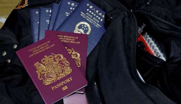 British National Overseas passports (BNO) and Hong Kong Special Administrative Region of the People's Republic of China passports sit on top of baggage in Hong Kong, China, December 17, 2020.