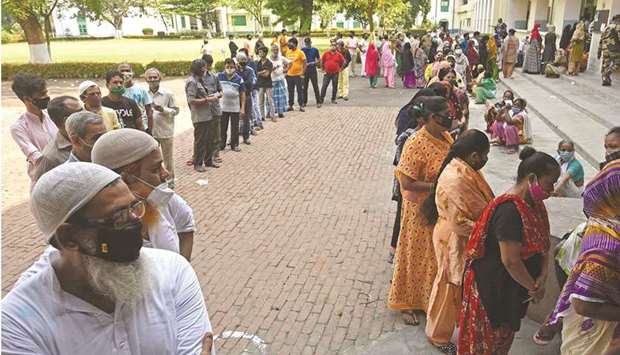 Voters queue up to cast their ballot during the final phase of West Bengalu2019s state legislative assembly elections in Kolkata yesterday.