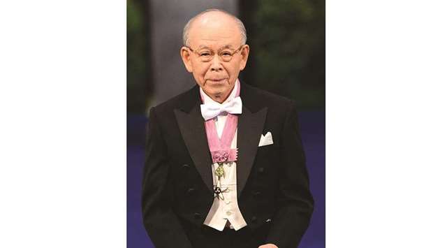 Nobel Physics laureate Isamu Akasaki of Nagoya University poses with the Nobel Prize in a file picture.