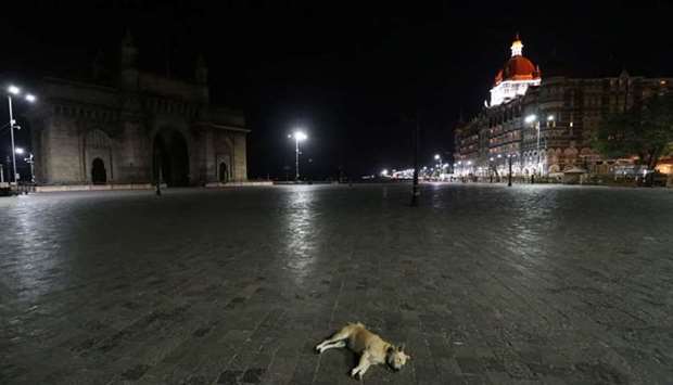 A view of the Gateway of India monument and the Taj Hotel during a curfew to limit the spread of the coronavirus disease, in Mumbai, India, March 29. REUTERS