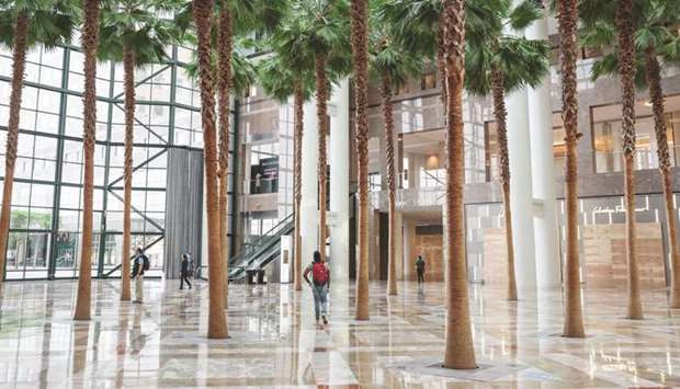 Pedestrians walk through Brookfield Place shopping centre in New York. Brookfield Asset Management said it reached a $6.5bn agreement to acquire the shares of Brookfield Property Partners, boosting its offer to take private its real estate arm.