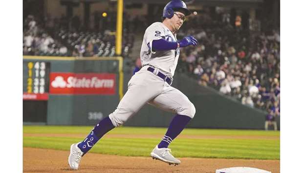 Los Angeles Dodgers second baseman Zach McKinstry runs out an inside the park home run in the eighth inning against the Colorado Rockies at Coors Field in Denver. (USA TODAY Sports)