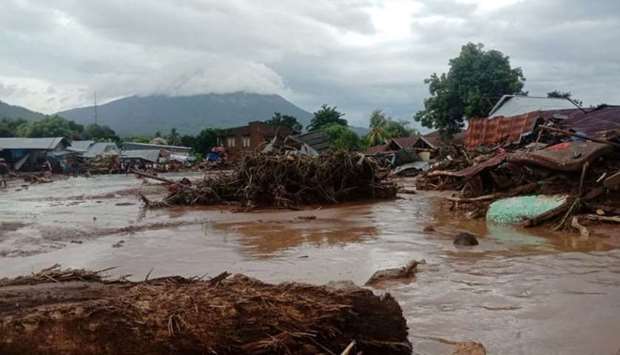 Damaged houses are seen at an area affected by flash floods after heavy rains in East Flores, East Nusa Tenggara province. Antara Foto/Handout/Dok BPBD Flores Timur/via REUTERS