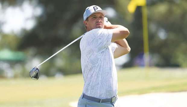 Bryson DeChambeau of the United States plays his shot from the third tee during a practice round prior to the Masters at Augusta National Golf Club yesterday.