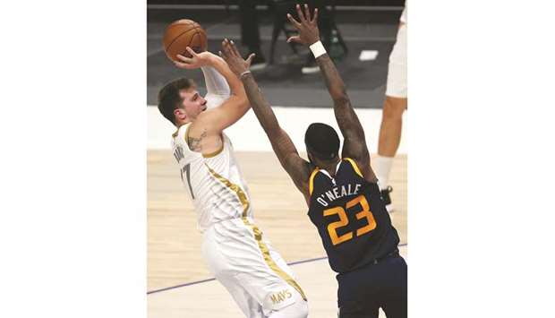 Luka Doncic (left) of the Dallas Mavericks takes a shot against Royce Ou2019Neale of the Utah Jazz in the second quarter at American Airlines Center in Dallas, Texas. (Getty Images/AFP)