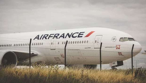 A Boeing 777 aircraft operated by Air France-KLM stands on the tarmac at Charles de Gaulle airport in Roissy, France. Air France posted a u20ac7.1bn ($8.4bn) loss in 2020 as its business suffered from coronavirus restrictions.