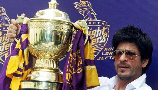 (file photo) Bollywood actor Shah Rukh Khan displays the Indian Premier League (IPL) cricket trophy