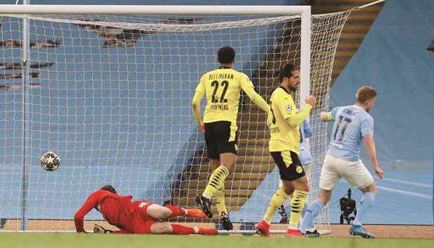 Manchester Cityu2019s Kevin De Bruyne scores against Borussia Dortmund in Manchester yesterday.