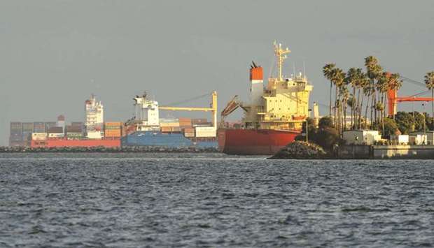 Container ships seen offshore at the Port of Long Beach in California. The US trade deficit jumped 4.8% to a record $71.1bn in February, the Commerce Department said yesterday.