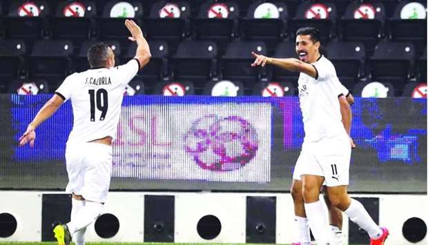 Santi Cazorla and Baghdad Bounedjah celebrate during Al Saddu2019s match against Al Rayyan earlier this week.