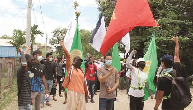 Demonstrators gesture as they protest against the military coup, in Dawei, Myanmar yesterday in this still image obtained from a video.