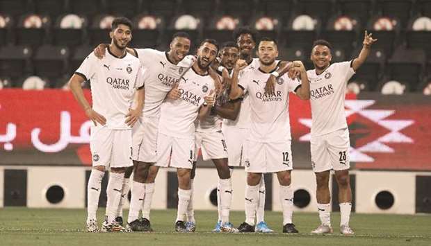Al Sadd players celebrate after their win over Qatar SC at the Jassim bin Hamad Stadium on Friday.