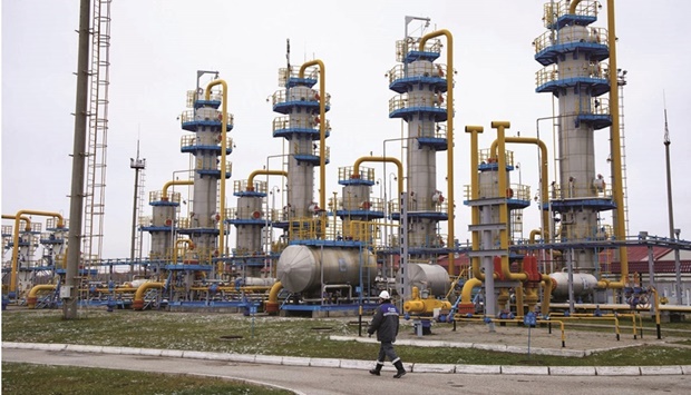 A worker passes a gas treatment unit at the Kasimovskoye underground gas storage facility, operated by Gazprom, in Russia. Gazprom has started telling clients how to pay for their gas after President Vladimir Putin said purchases from u201cunfriendlyu201d nations would need to be settled in roubles.