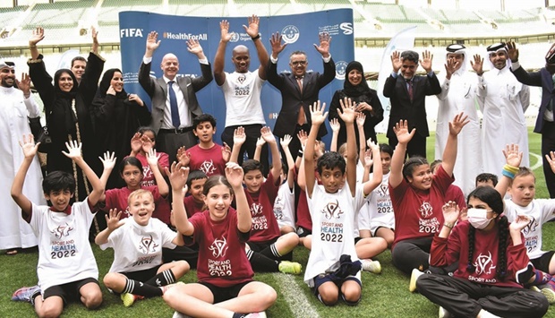 The dignitaries along with young footballers at the launch of 'Healthy FIFA World Cup Qatar 2022 - Creating Legacy for Sport and Health' yesterday at the Education City Stadium. PICTURE: Thajudheen.