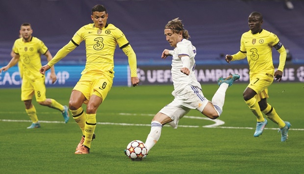 Real Madridu2019s Luka Modric (second right) and Chelseau2019s Thiago Silva vie for the ball during the Champions League quarter-final second leg in Madrid on Tuesday. (Reuters)
