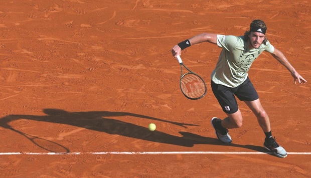 Greeceu2019s Stefanos Tsitsipas plays a forehand return to Germanyu2019s Alexander Zverev during their Monte Carlo ATP Masters semi-finals in Monaco yesterday. (AFP)