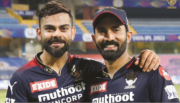 Former India captain Virat Kohli (left) is seen with Dinesh Karthik after Royal Challengers Bangalore beat Delhi Capitals in their Indian Premier League match on Saturday.