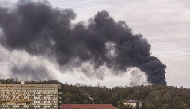 Smoke rises after Russian missile strikes in Lviv yesterday. (Reuters)