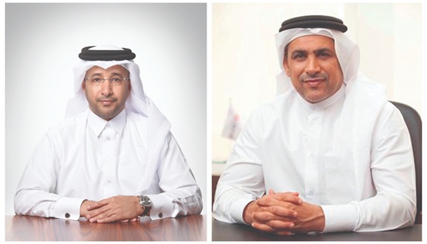 Fahad bin Abdullah al-Khalifa, group chief executive, Masraf Al Rayan, left and Abdul Hakeem Mostafawi, chief executive, HSBC Qatar.