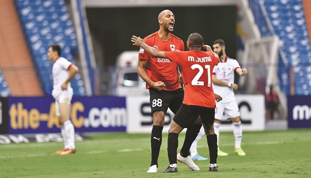 Al Rayyanu2019s Steven Nu2019zonzi (left) celebrates with teammate Mohamed Jumaa after scoring against Sharjah in Group A encounter of the AFC Champions League at the King Fahd International Stadium in Riyadh on Tuesday.