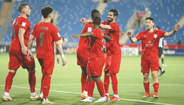Al Duhail players celebrate after scoring against Pakhtakor in the AFC Champions League Group D match on Monday.
