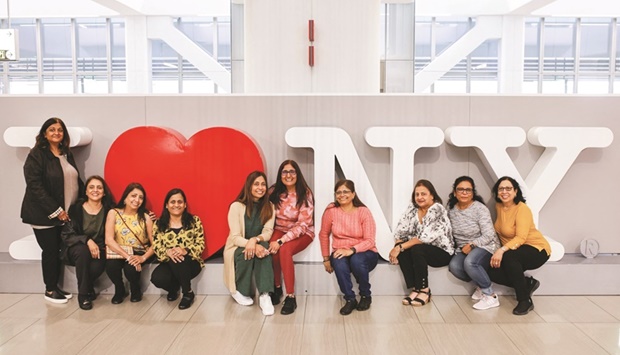 People without masks pose for a picture at La Guardia Airport after the Biden administration announced it would no longer enforce a mask mandate on public transportation, following a federal judgeu2019s ruling that the 14-month-old directive was unlawful, in New York yesterday. (Reuters)