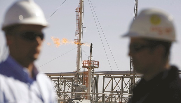 Technicians stand at the Krechba gas treatment plant, about 1,200km (746 miles) south of Algiers (file). ENI said the deal with Algeriau2019s Sonatrach would boost deliveries of gas through the Transmed undersea pipeline by u201cup to 9bn cubic metres per yearu201d by 2023-24.