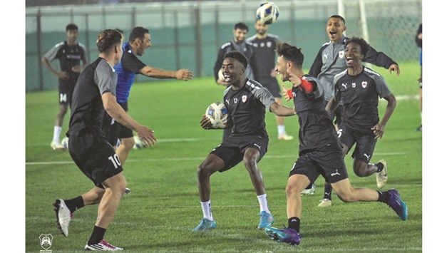Al Rayyan players share a light moment during training session.
