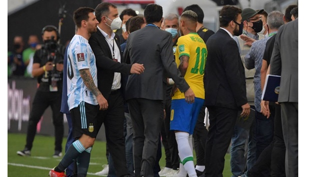 Argentinau2019s Lionel Messi and Brazilu2019s Neymar talk as the match is interrupted by health authorities in September.