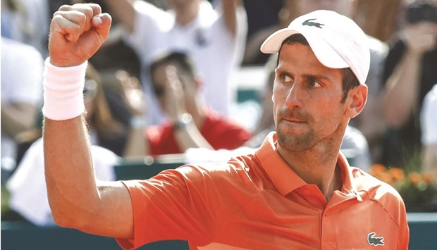 Serbiau2019s Novak Djokovic celebrates his victory against Russiau2019s Karen Khachanov at the end of their Serbia Open, an ATP 250 points tournament, in Belgrade yesterday. (AFP)