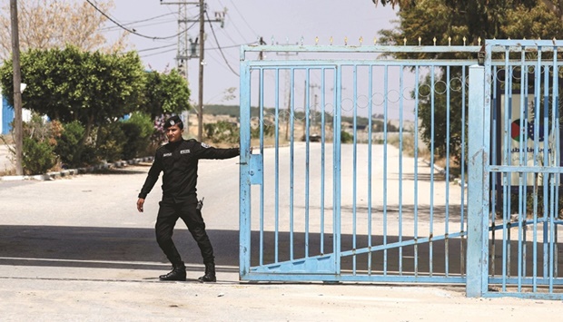 A police officer stands guard at the Palestinian Authority (PA) side of the Erez Crossing in Beit Hanoun in the northern Gaza Strip, yesterday.
