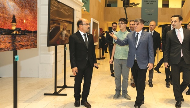 Turkish ambassador to Qatar Mehmet Mustafa Goksu opens the u201cEssence of contemporary Turkish Photographyu201d exhibition at Msheireb Downtown Doha.