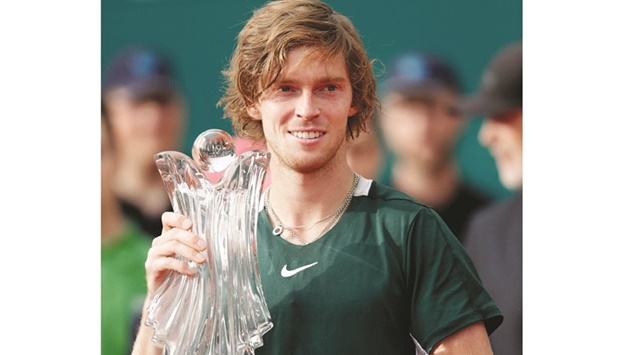 Russiau2019s Andrey Rublev poses with the trophy after victory in the final against Serbiau2019s Novak Djokovic at Serbia Open in Belgrade yesterday. (AFP)