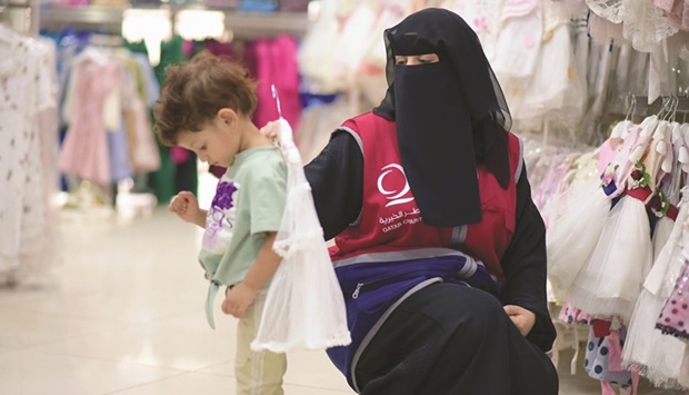The distribution of Eid clothes has drawn a smile on the faces of the children, and removed the worries of many families who were unable to provide Eid clothes for their orphaned children, a QC statement said on Tuesday.
